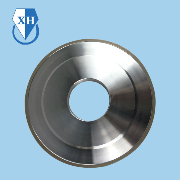 What are the key properties and advantages of using bronze as a bonding material in grinding wheels